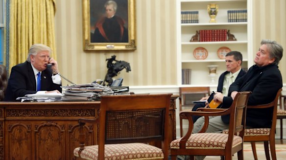 President Donald Trump with Mike Flynn (centre) and Steve Bannon (right) in the Oval Office during the call to Prime Minister Malcolm Turnbull.