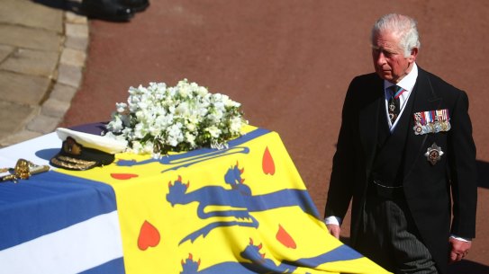 WINDSOR, ENGLAND - APRIL 17: Prince Charles, Prince of Wales walks behind The Duke of Edinburghâs coffin, covered with His Royal Highnessâs Personal Standard, during the Ceremonial Procession during the funeral of Prince Philip, Duke of Edinburgh at Windsor Castle on April 17, 2021 in Windsor, England. Prince Philip of Greece and Denmark was born 10 June 1921, in Greece. He served in the British Royal Navy and fought in WWII. He married the then Princess Elizabeth on 20 November 1947 and was created Duke of Edinburgh, Earl of Merioneth, and Baron Greenwich by King VI. He served as Prince Consort to Queen Elizabeth II until his death on April 9 2021, months short of his 100th birthday. His funeral takes place today at Windsor Castle with only 30 guests invited due to Coronavirus pandemic restrictions. (Photo by Hannah McKay/WPA Pool/Getty Images)