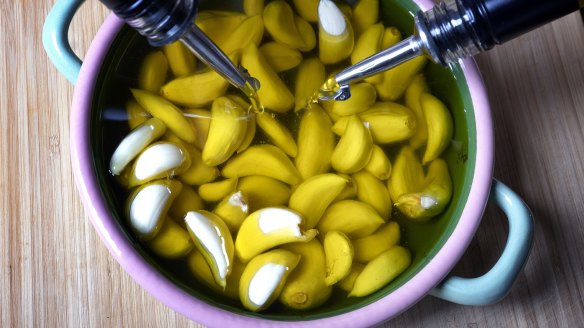 Daen's famous garlic confit in progress.