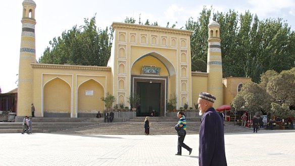 An elderly Uighur man in front of Kashgar's Id Kah mosque, Xinjiang, China.