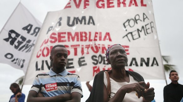 Protesters gather in Rio de Janeiro on Sunday after the Supreme Court opened an investigation into allegations that Temer endorsed bribery payments. 