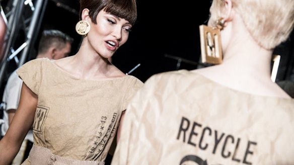 Models are seen backstage ahead of the Moschino show during Milan Fashion Week.