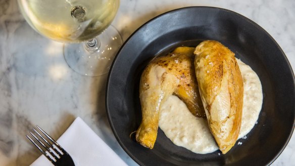 Slow-roasted smoked chicken on a bed of bread sauce.