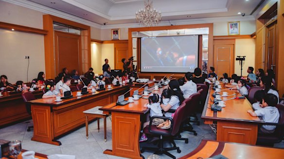 Pupils of the Domba Kecil school watch a scene from <i>Finding Nemo</i> with Jakarta governor Basuki Tjahaja Purnama in city hall in April last year.