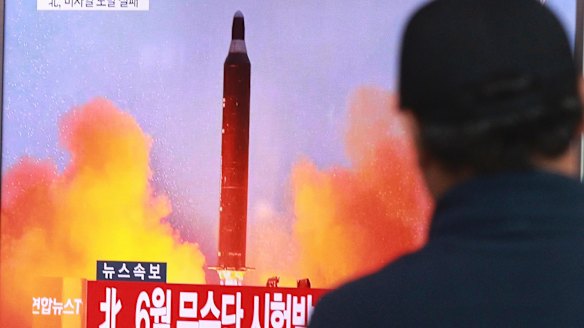 A man in Seoul watches a TV news program on North Korea's missile launches last year..