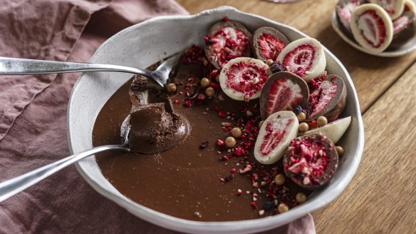 Chocolate mousse adorned with chocolate-covered freeze-dried berries.