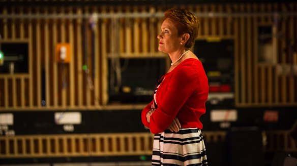 One Nation leader Pauline Hanson on the set of <i>Insiders</i>, watching host Barrie Cassidy.