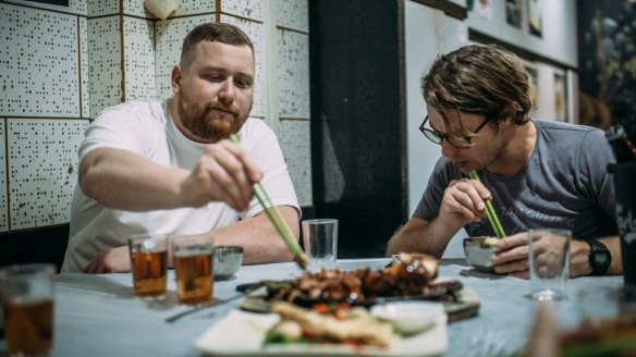 Patrick Friesen (left) and Christopher Hogarth at Tai Chung Wang, which is famous for its black pepper pork knuckle. The chefs will offer their version of this dish as a special at Queen Chow.