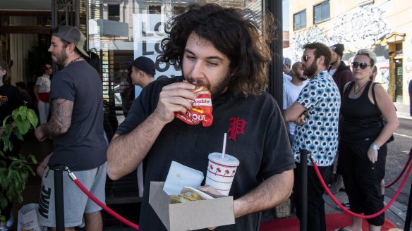 Jordan Zaz eats a burger. He says it's "fine".