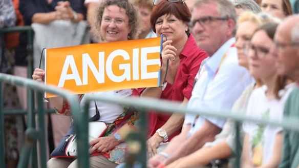Supporters hold a sign as German Chancellor Angela Merkel speaks during an election campaign stop in Koblenz, Germany, on Wednesday.