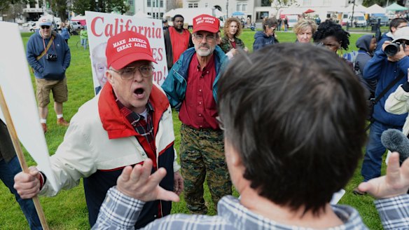 Trump supporter Jim Templeton, left, yells at an anti-Trump protester at a dual rally for and against President Donald Trump on  March 4.