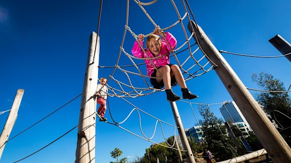 Anna, 6, hangs around at the playground. 
