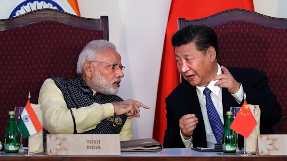  Indian Prime Minister Narendra Modi, left, talks with Chinese President Xi Jinping at the BRICS summit in Goa, India, last year.