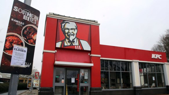 A closed sign is seen outside a KFC restaurant near Ashford, England on Monday.