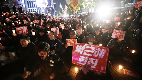 Protesters call on South Korean President Park Geun-hye to resign.