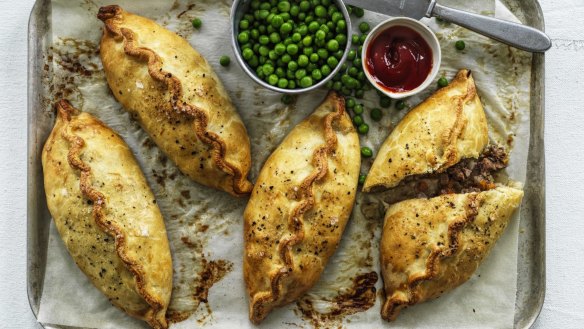 Serve these Cornish pasties with peas and tomato sauce.