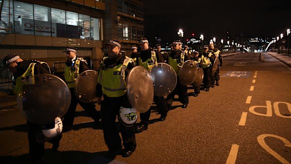 Police walk over Southwark Bridge after an attack in the centre of London.