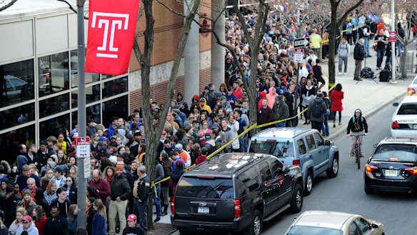 People wait in line to see Democratic presidential hopeful Bernie Sanders at Temple University in Philadelphia.