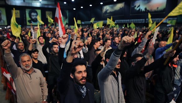 Supporters of the Lebanese Shiite party Hezbollah cheer as they listen to a speech by their leader Hassan Nasrallah in Beirut in February.