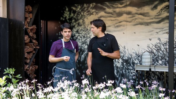 Chef Virgilio Martinez (left) with Ben Shewry in Attica's rear courtyard. 
