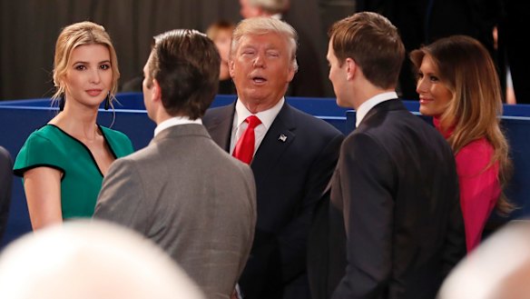 Donald Trump, centre, talks to his daughter Ivanka, left, Donald Jr, Ivanka's husband Jared Kushner and his wife Melania Trump after the second presidential debate.