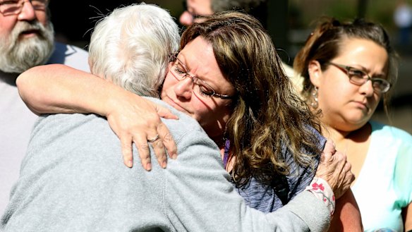 Friends and family are reunited with students after the shooting.