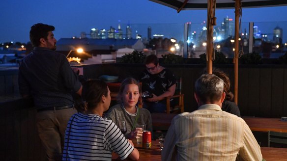 Peak Brunswick: Carousing vegans against a backdrop of city lights atop the Cornish Arms.