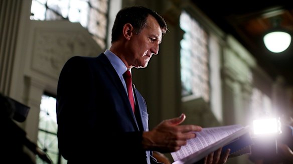 Lord Mayor Graham Quirk peruses the 2015-16 Brisbane City Council Budget before handing it down on Wednesday.