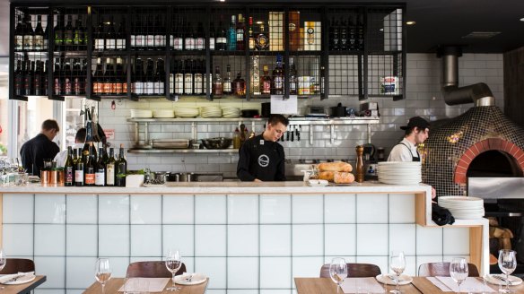 An almost entirely open kitchen takes up half of the venue.