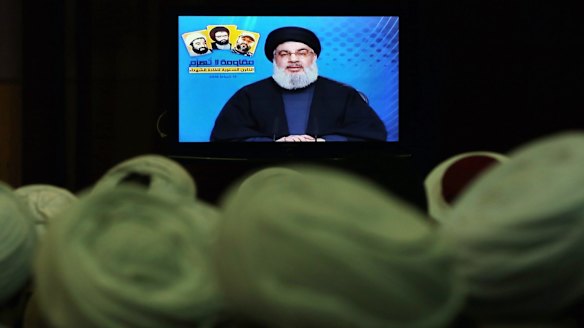 Shiite and Sunni clerics listen to Hezbollah leader Sayyed Hassan Nasrallah, via video link, during a ceremony to honour fallen Hezbollah leaders, in Beirut, Lebanon, on Tuesday.