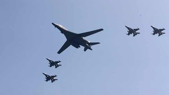 A US B-1 bomber flanked by fighter jets during a show of force over the Korean Peninsula in September 2016.