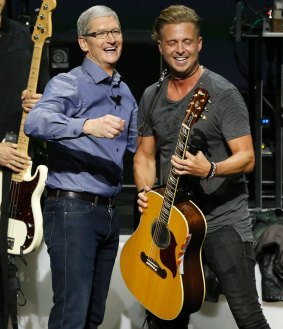 The Applecore look: Apple chief executive Tim Cook on stage with Ryan Tedder of OneRepublic.