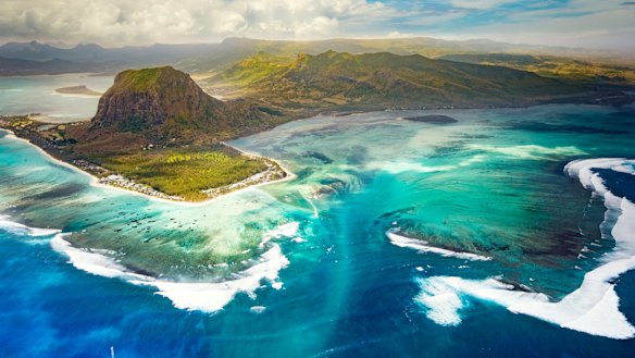 The amazing "underwater waterfall" effect can be seen from the air looking back towards Le Morne.