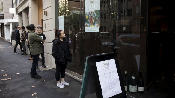 People queue to buy rare wines at Monopole in Potts Point.