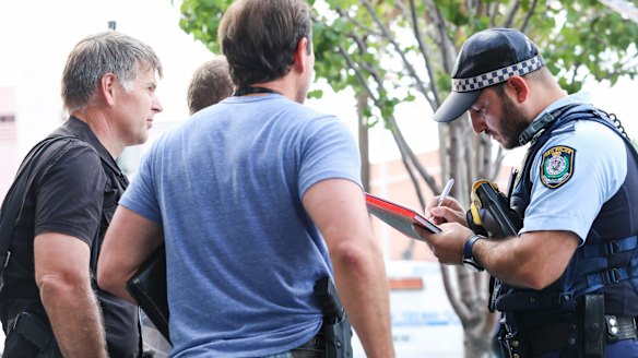 Uniformed police and detectives walked in and out of the crime scene, speaking to witnesses and asking businesses for their CCTV footage.