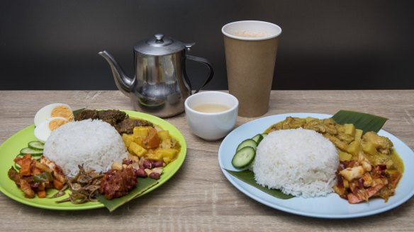 Nasi lemak (left) with two sides, vegetable curry and beef rendang, with nyonya chicken curry, and teh tarik.