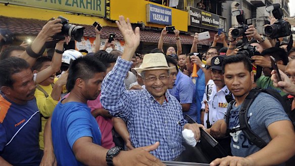Malaysia's former Prime Minister Mahathir Mohamad waves to activists at a protest  rally in Kuala Lumpur last month. 