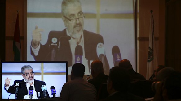 Hamas leaders and supporters in Gaza City listen to Khaled Mashaal, the outgoing Hamas leader, launch a new manifesto from Doha, Qatar, in May.