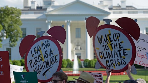 Protesters gather outside the White House in Washington on Thursday.