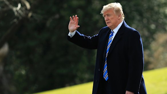 President Donald Trump waves as he leaves the White House in Washington last month.