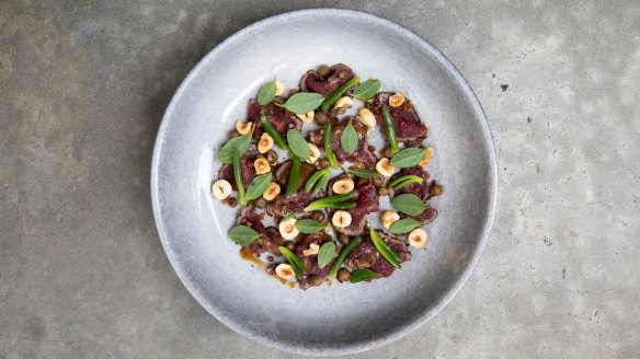 Cured kangaroo with wattleseed, muntries, karkalla and hazelnuts.