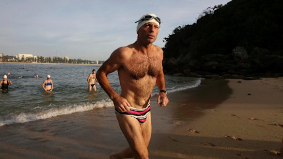 Mr Abbott competing in a charity swim in 2010, after which his budgie smugglers were auctioned on eBay.