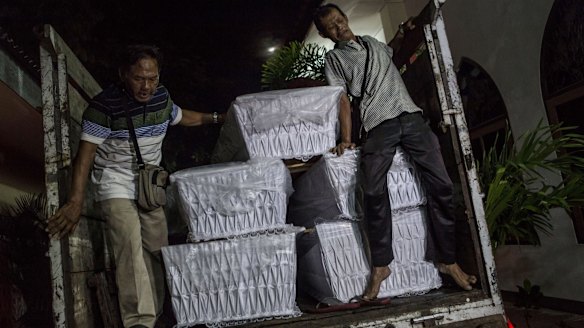 Coffins are loaded on trucks at the Bali;s port city Cilacap in central Java in anticipation of the Bali duo's execution.