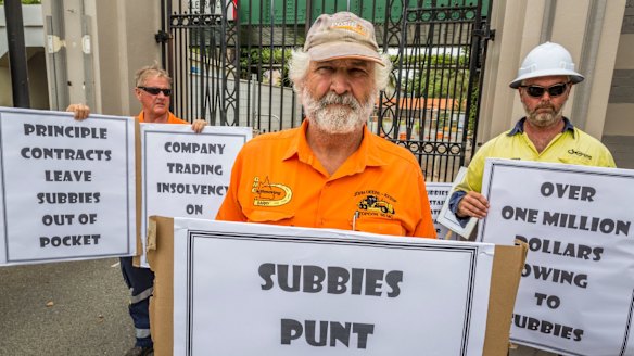 Subcontractor Barry Mitchell protests at the Eagle Farm redevelopment where two men were crushed to death, claiming he hasn't been paid for months.