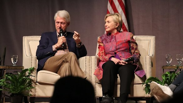 Accompanied by his wife, Hillary Clinton, former President Bill Clinton marks 25 years since his election, last month.