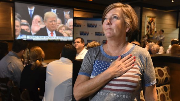 Victoria Barette from Jacksonville, Florida, puts her hand on her heart on inauguration day. 