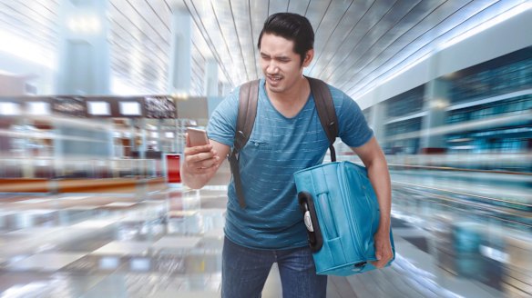 Young asian tourist rushing to boarding a plane on the departure area