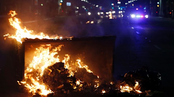 A fire burns during protests at Trump's victory in Oakland, California, late on Tuesday.