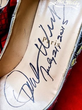 The billionaire, 61, also signed the eye-catching designer shoes, size 41. 