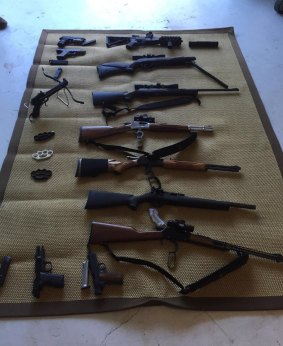 Weapons uncovered in raids on two south-eat Queensland properties.